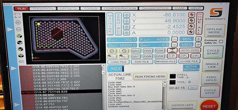CNC router control screen showing the live toolpath simulation and machine coordinates mid-job.