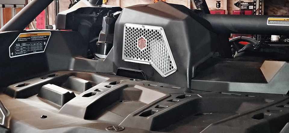 Can-Am Maverick X3 dash and door panel fitted with the relocated hex-pattern intake grille.