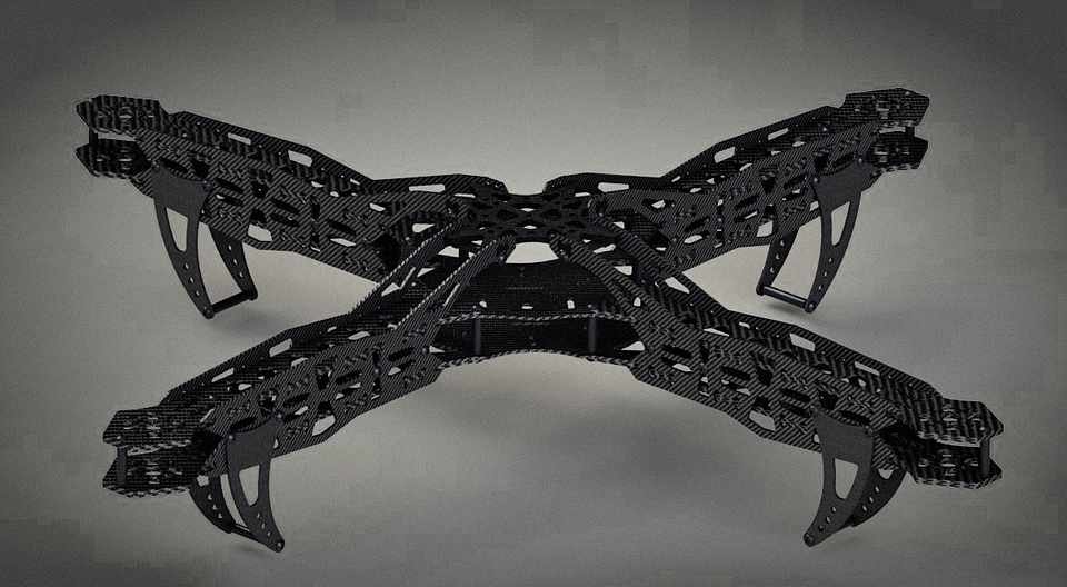 Karbonic-600X quad frame render from a low front angle, showing the arm taper and motor mounts.